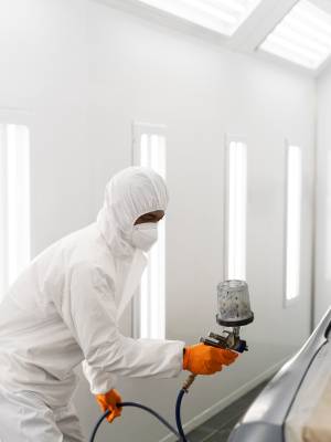 service-worker-painting-car-auto-service_23-2149487042